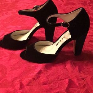 Anne Klein Henrika ankle strap peep toe pumps.
